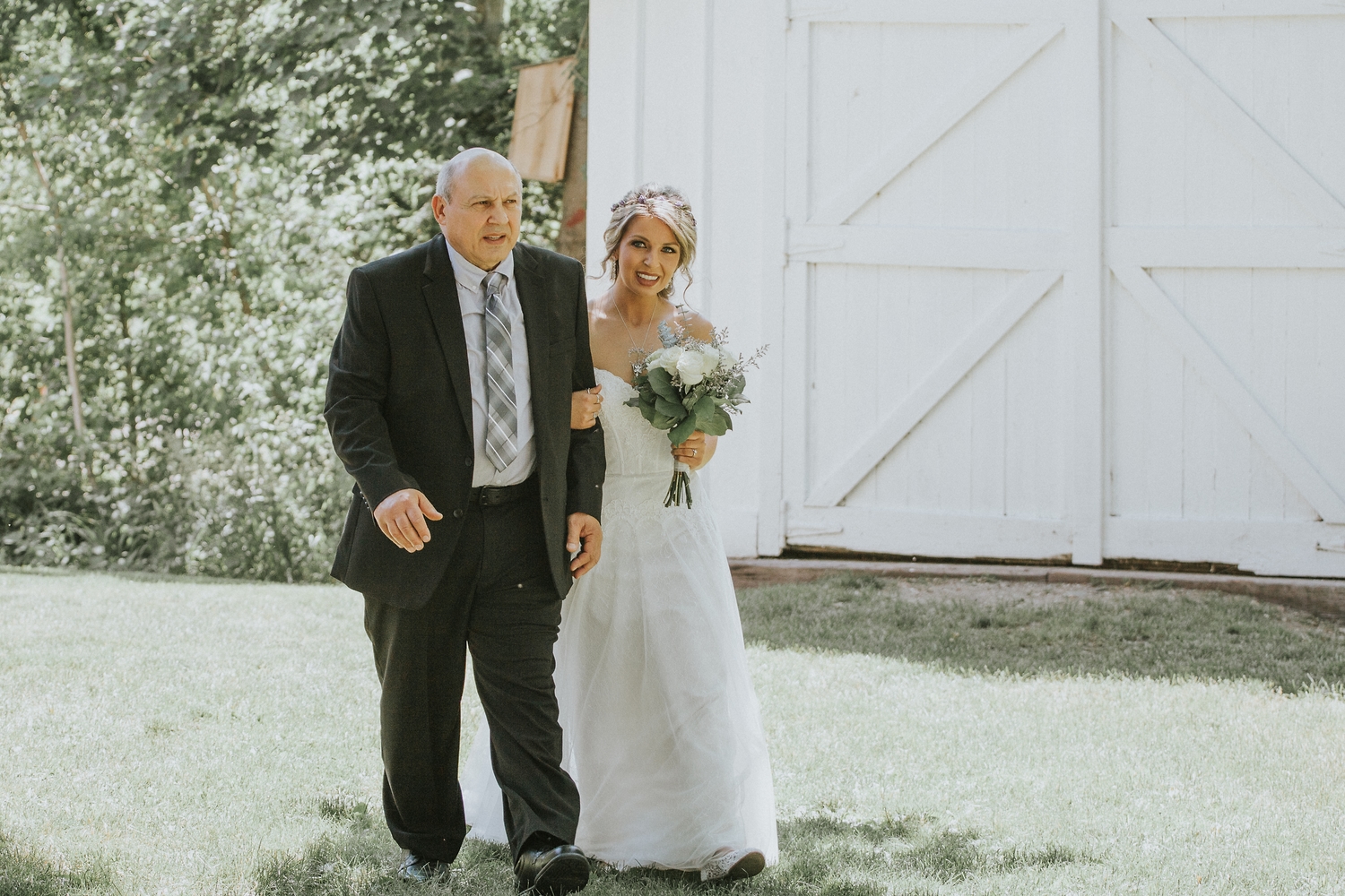 Father walking the bride to the ceremony